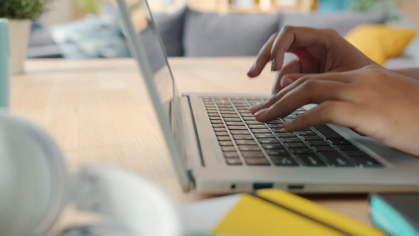 Hands typing on a laptop while working through a HubSpot task