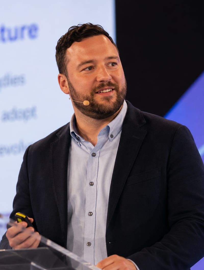 Adam, Founder & Principal Consultant, speaking at a conference